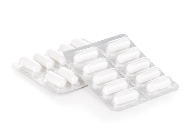 Capsule pills in blister pack close-up isolated on white background. Capsule pills in blister pack close-up isolated on a white background. tablets blister stock pictures, royalty-free photos & images