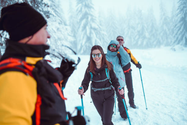 istock Senior Alpinist Leading His Team Through Snowy Trail 1196719209