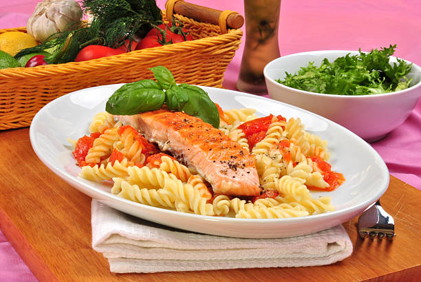 istock grilled organic salmon on some tomato pasta 119671997