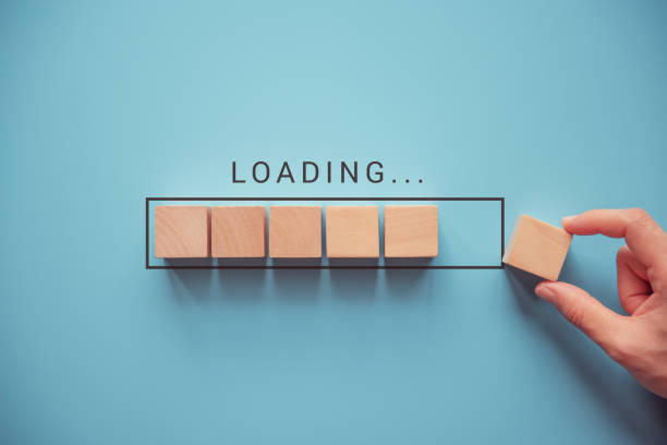 loading with hand putting wood cube in progress bar. - determination new years eve list aspirations imagens e fotografias de stock