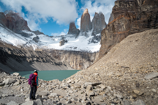 Hiker at Mirador Base Las Torres in Torres del Paine National Park, Patagonia, Chile, South America.
