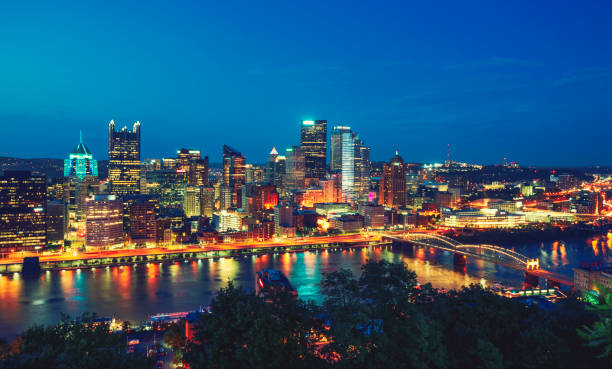 istock Pittsburgh Pennsylvania downtown aerial view night 1196725495