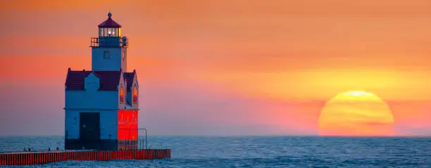 Majestic Kewaunee Wisconsin Lighthouse with magnificent Lake Michigan December sunrise.