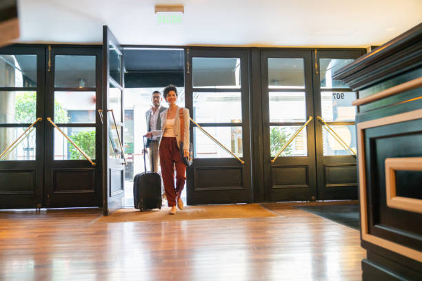 istock Young business people entering the hotel 1196729303