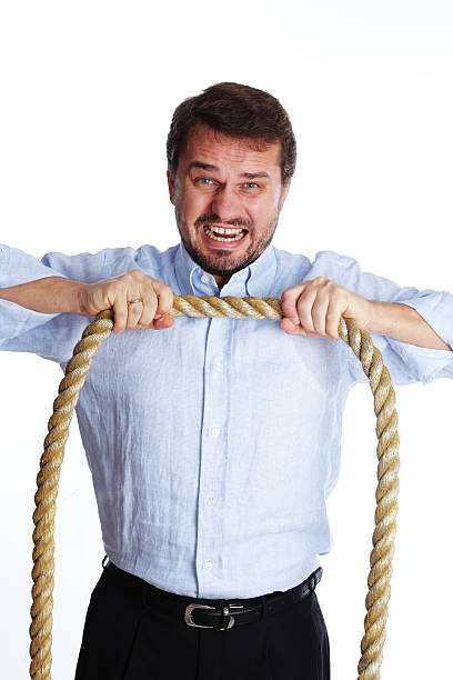 istock Mature businessman with a rope 119673027
