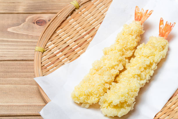 Deep fried shrimp on wood grain background Deep fried shrimp on wood grain background Tempura Prawns stock pictures, royalty-free photos & images