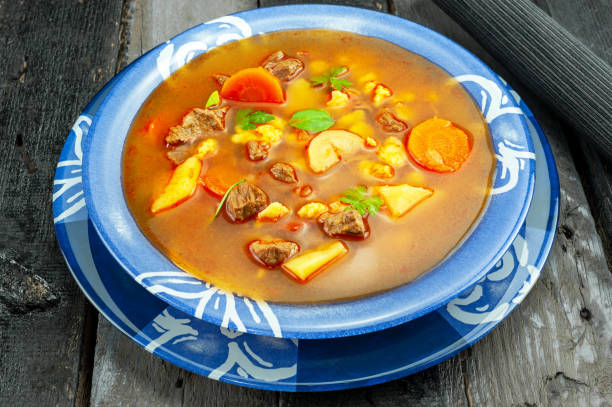 istock Goulash soup on wooden table 1196733075