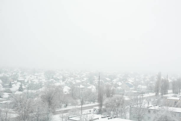 istock Snow blizzard in a small town. Everything is covered with white snow. 1196734814