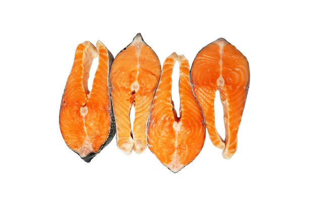 istock Salmon steaks isolated on white background, top view. Fresh raw salmon, red fish 1196735910