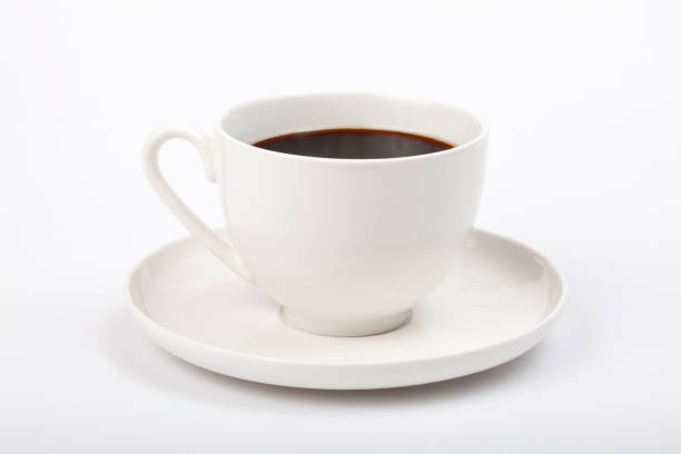 istock cup of coffee with beans on white background 1196738656
