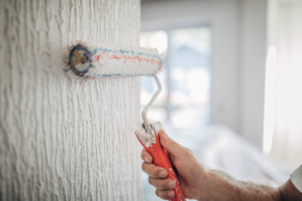 istock Hand painting wall in apartment 1196738877