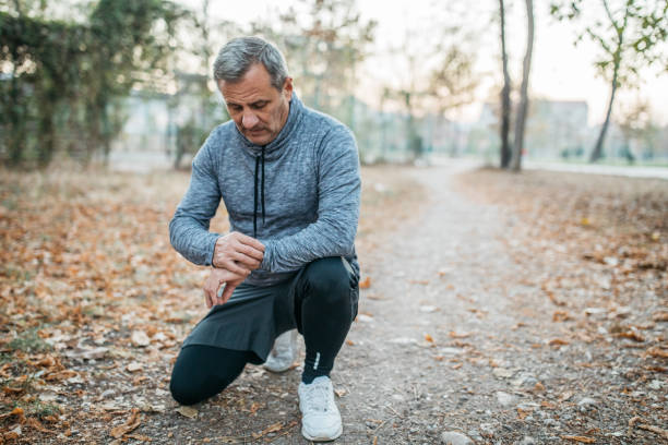 istock Senior Man using Smart Watch measuring heart rate 1196740356