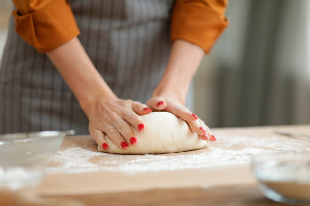 Woman Kneading Fresh Batter Closeup