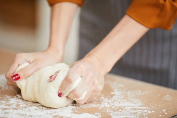 istock Young Woman Kneading Homemade Batter 1196741085