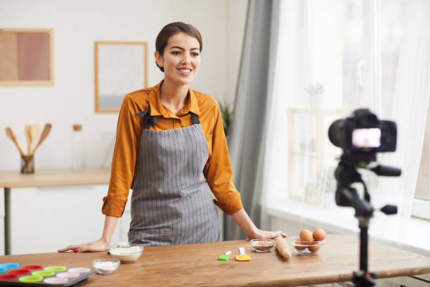 istock Filming Cooking Video in Kitchen 1196741096