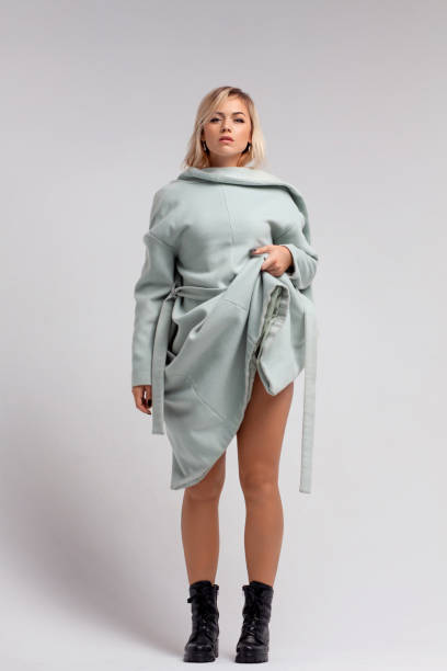 istock Beautiful woman wearing coat inside out. 1196743912