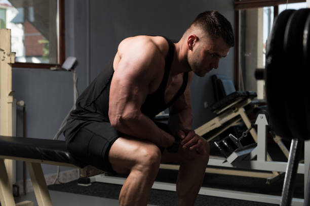 istock Attractive Young Man Resting In Gym Afther Exercise 1196746436
