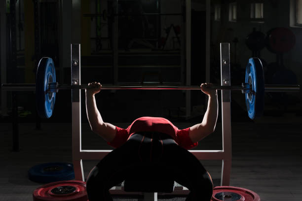 istock Heavy Powerlifter Weight Barbell Exercise Benchpress in Powerlifting 1196746453