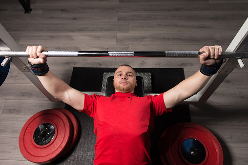 Professional Athlete Is Lying and Is Holding a Very Heavy Barbell