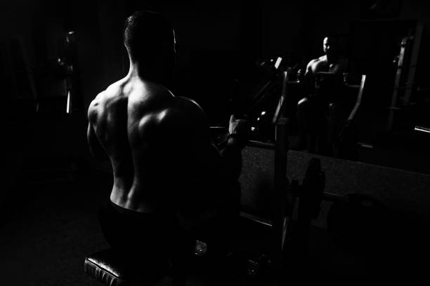istock Muscular Man Doing Heavy Weight Exercise For Back 1196746491