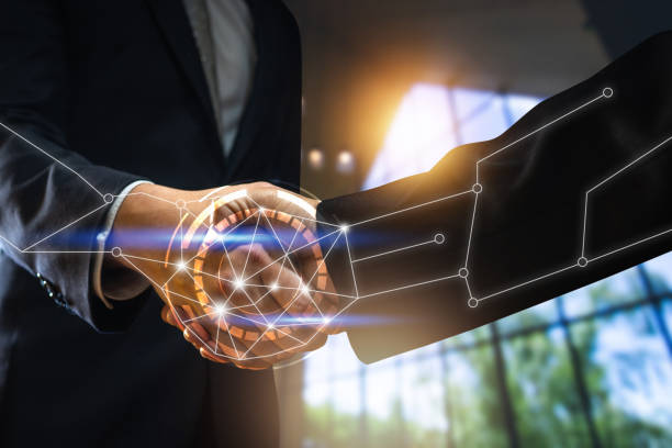 istock handshake and technology concept, businessmen shake hand with partner and connection line 1196747327