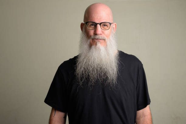 istock Mature bald man with long gray beard wearing eyeglasses 1196751960