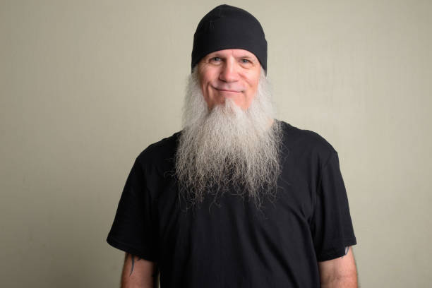 Mature man with long gray beard wearing beanie hat