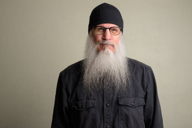 istock Mature man with long gray beard wearing eyeglasses 1196752017