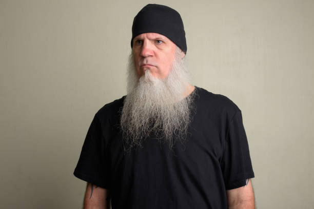 istock Angry mature man with long gray beard thinking 1196752402