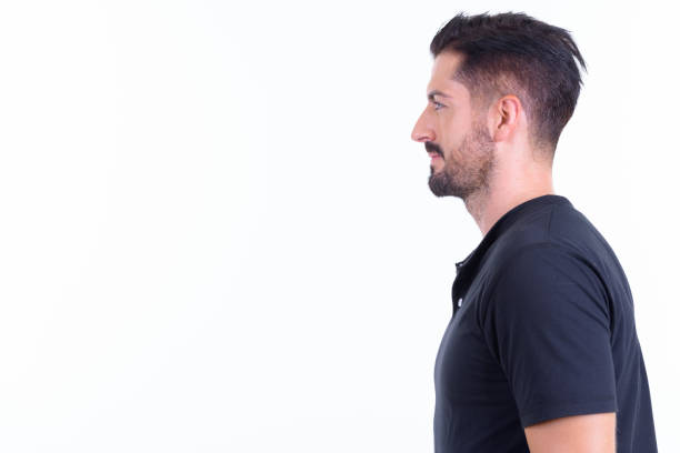 istock Closeup profile view of young handsome bearded man 1196753960