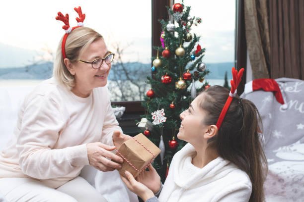 istock Celebrating christmas with christmas gift 1196754135