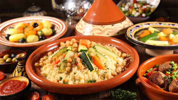 assorted of traditional moroccan tajine with dried fruits and spices assorted of traditional moroccan tajine with dried fruits and spices couscous stock pictures, royalty-free photos & images