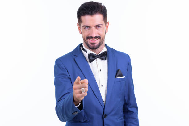 istock Happy young handsome bearded businessman pointing at camera 1196754334