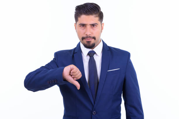 istock Stressed bearded Persian businessman giving thumbs down 1196756721