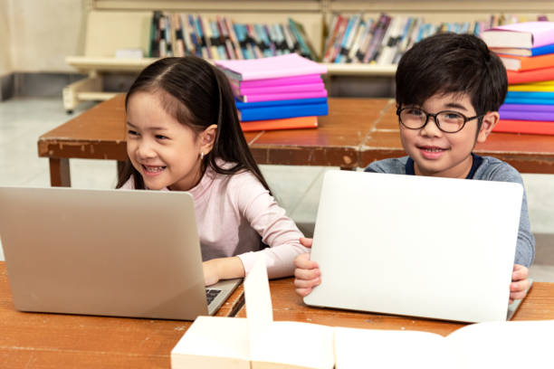 istock Education image,asian children happy learning in library at school. 1196756974