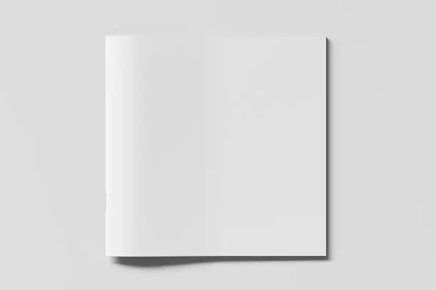 Blank square brochure or booklet cover mock up on white. Isolated with clipping path around brochure. View above.  3d illustratuion