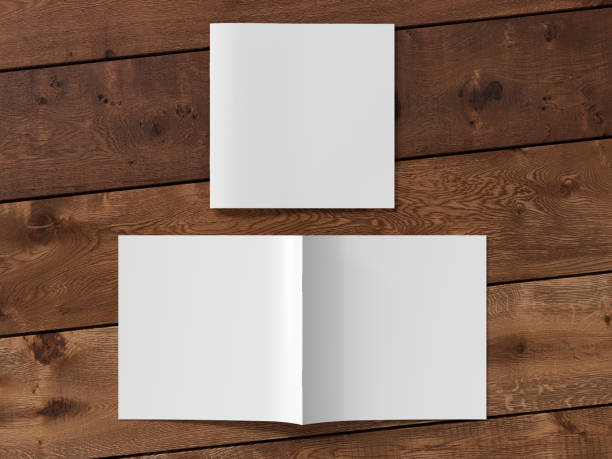 istock Square brochure or booklet cover. Closed one brochure and upside down other. 1196759302