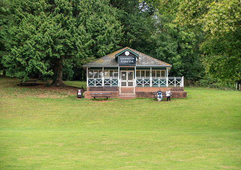 Torquay, UK - 28 September 2019: Cricket club pavilion in Cockington Village near Torquay in South Devon