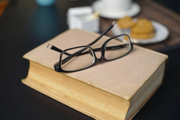 istock Eye glasses on old books 1196766041