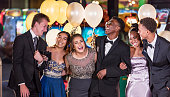 Group of multi-racial teenagers having fun at prom