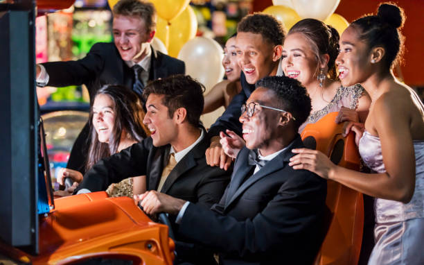 Teenagers after prom at video arcade