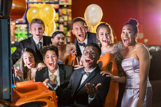 istock Teenagers after prom at video arcade 1196768214