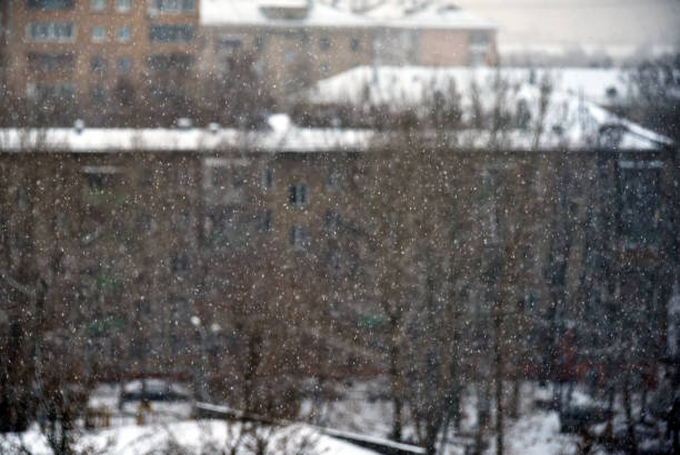 istock Blurred city landscape during a heavy snowfall 1196778140