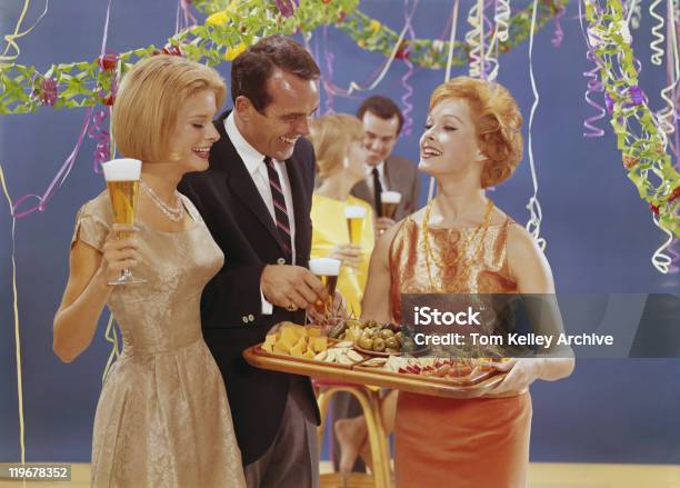 Woman Serving Appetizers At Party Smiling Stock Photo - Download Image Now - Archival, Party - Social Event, 1950