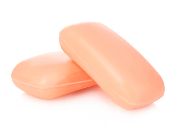 Pieces of orange soap isolated on a white background.