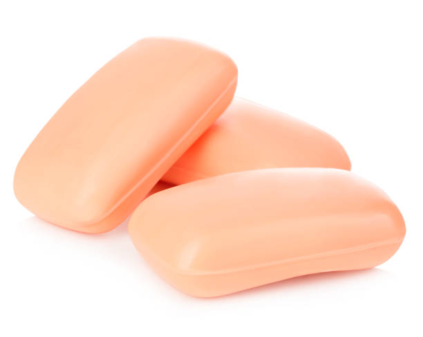 istock Pieces of orange soap isolated on a white background. 1196786723