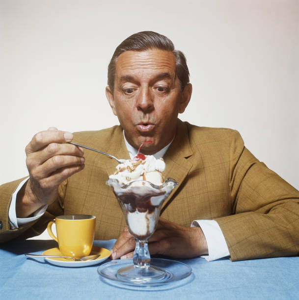 Man eating ice cream  cherry photos stock pictures, royalty-free photos & images
