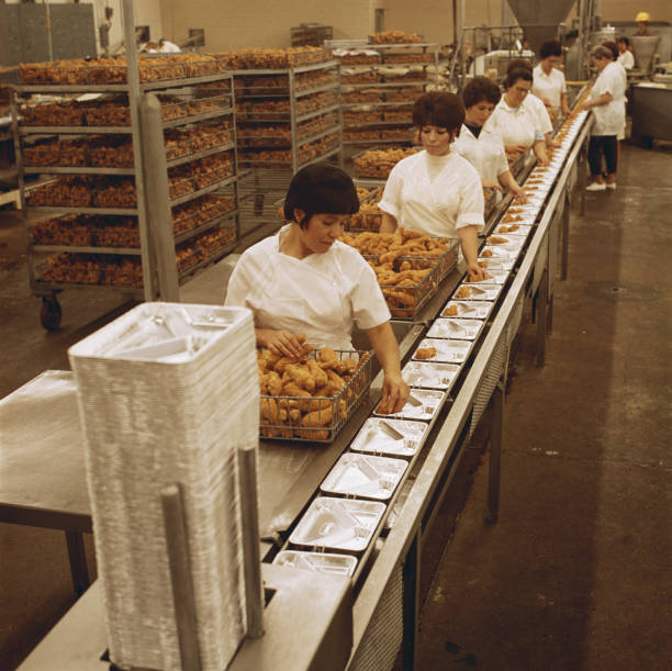 Female workers working at food processing plant  manufacturing occupation photos stock pictures, royalty-free photos & images