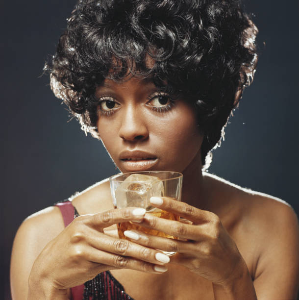 Young woman holding glass of drink, portrait, close-up  1971 stock pictures, royalty-free photos & images