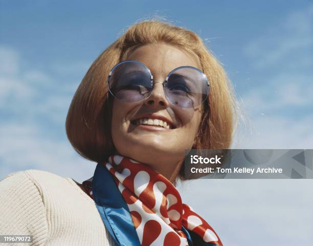 Young Woman Wearing Sunglasses Smiling Closeup Stock Photo - Download Image Now - Archival, Fashion, One Woman Only